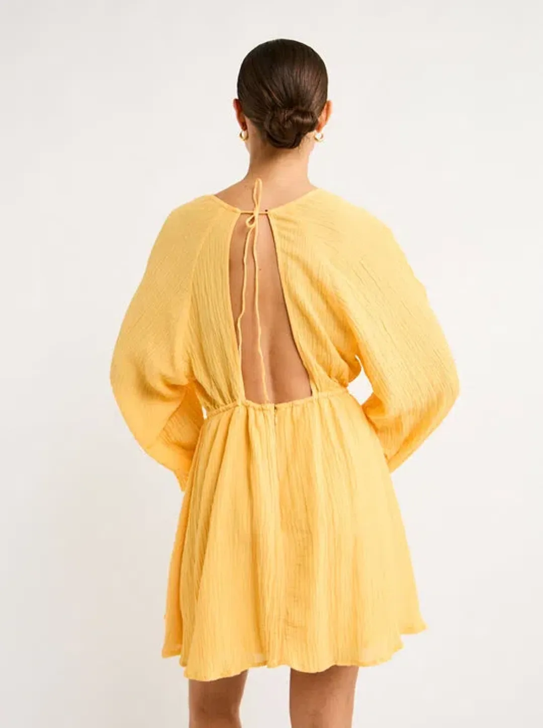 Faithfull the Brand Constance Mini Dress in Saffron Size 6  for rent on The Volte - main image