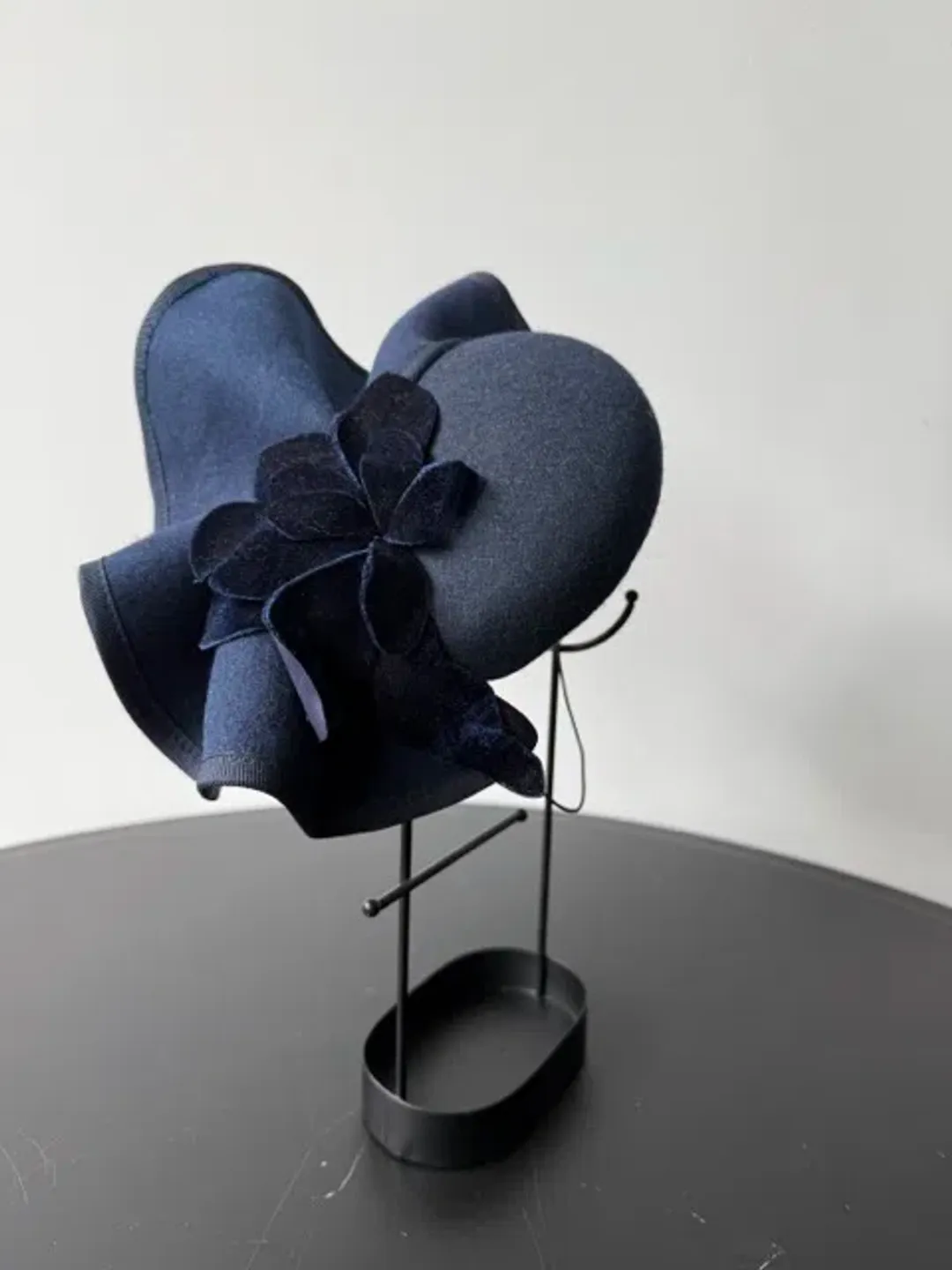 Felted Wool Headpiece with Sculptural Detail and Floral Velvet Adornment Navy One Size for rent on The Volte - main image