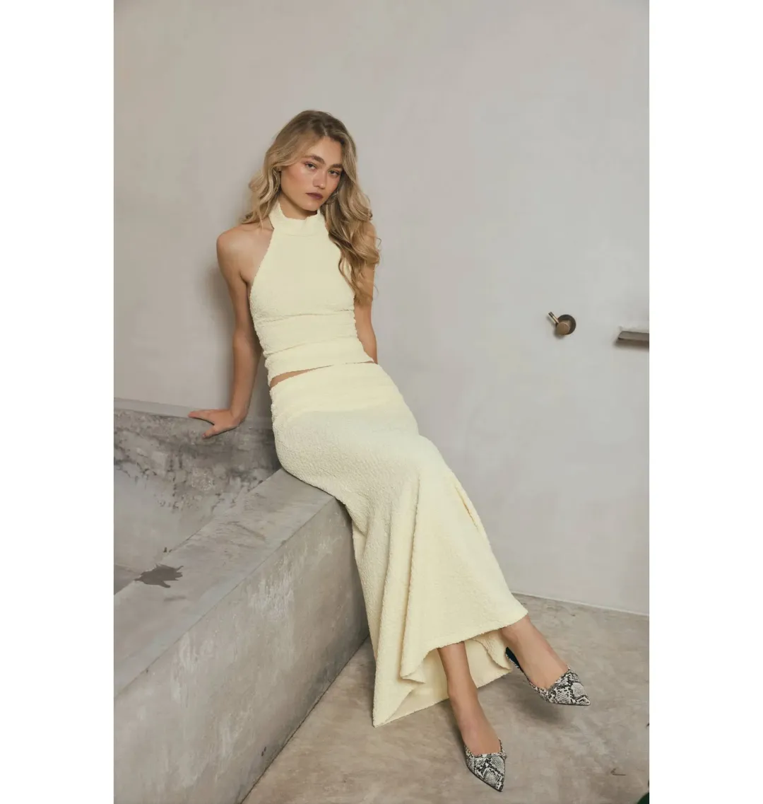 With Harper Lu Textured Halter Top and Maxi Skirt in Limoncello Set Size M / AU 10 for rent on The Volte - main image