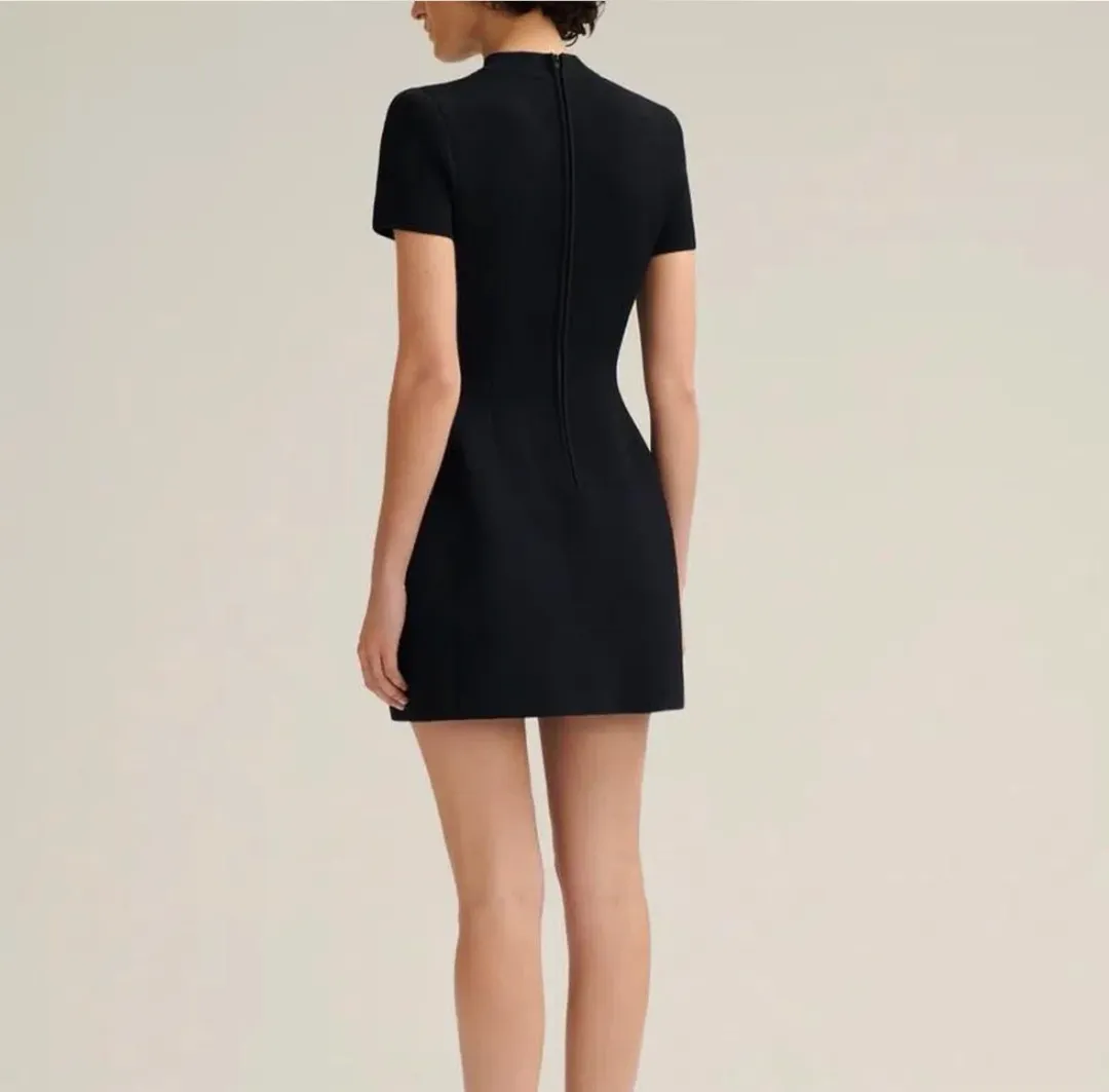 Scanlan Theodore Crepe Knit Peplum Mini Dress Black Size S / AU 8 for rent on The Volte - main image