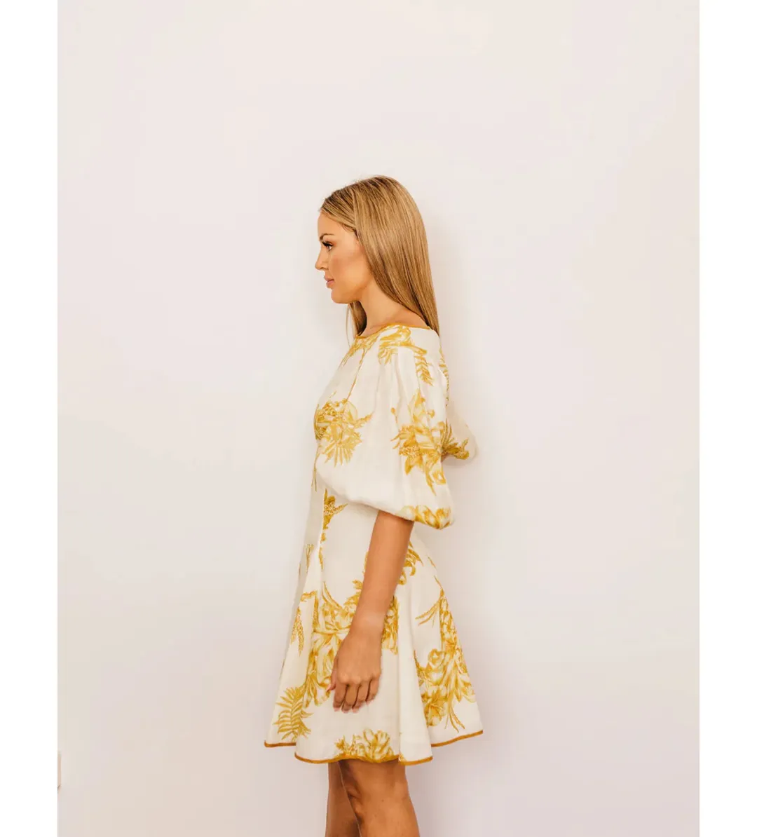 Zimmermann Empire Linen Puff Sleeve Mini Dress in Gold Size 0 /AU 8  for rent on The Volte - main image