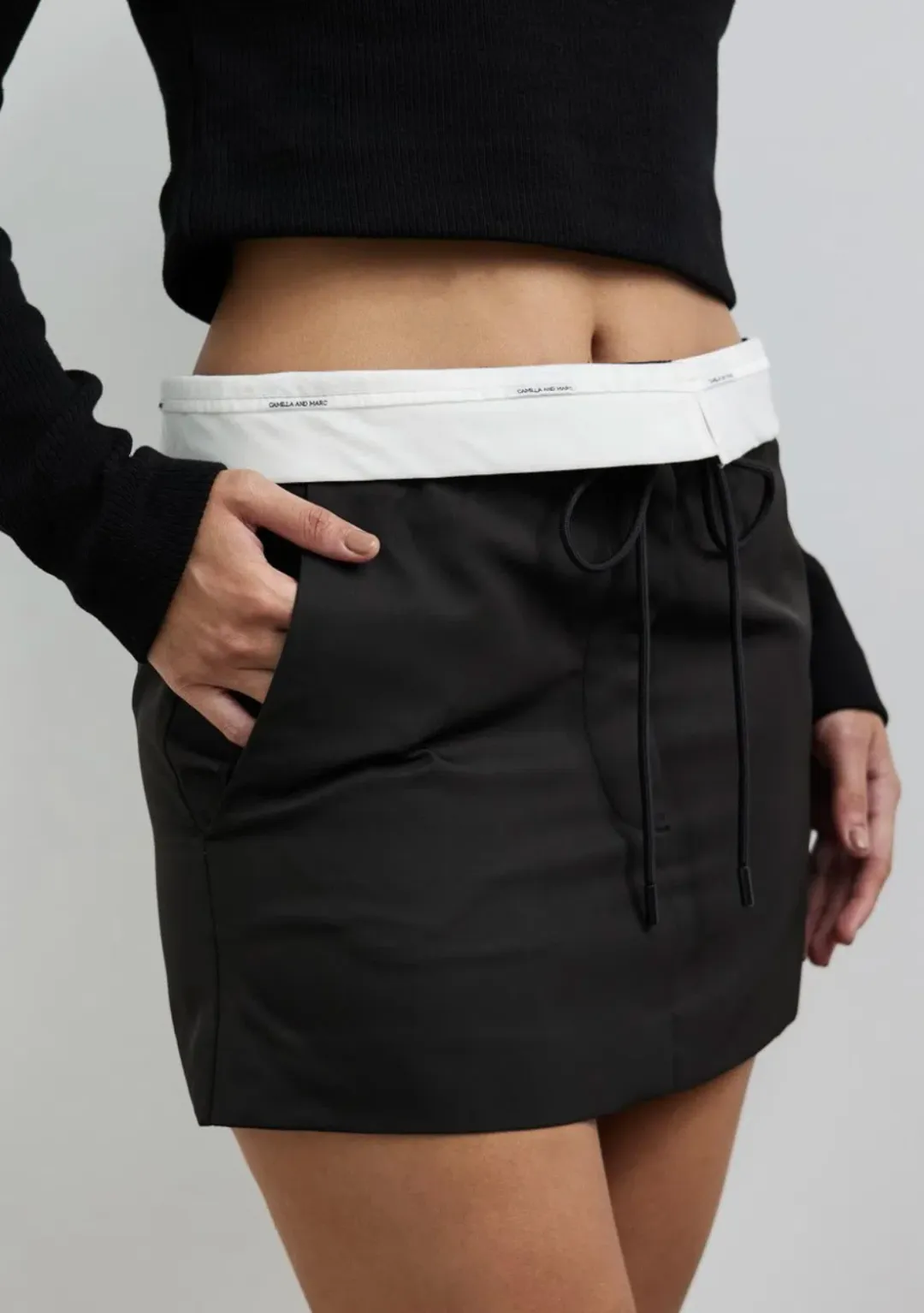Camilla and Marc Conrad Mini Skirt Black Size 8 for rent on The Volte - main image
