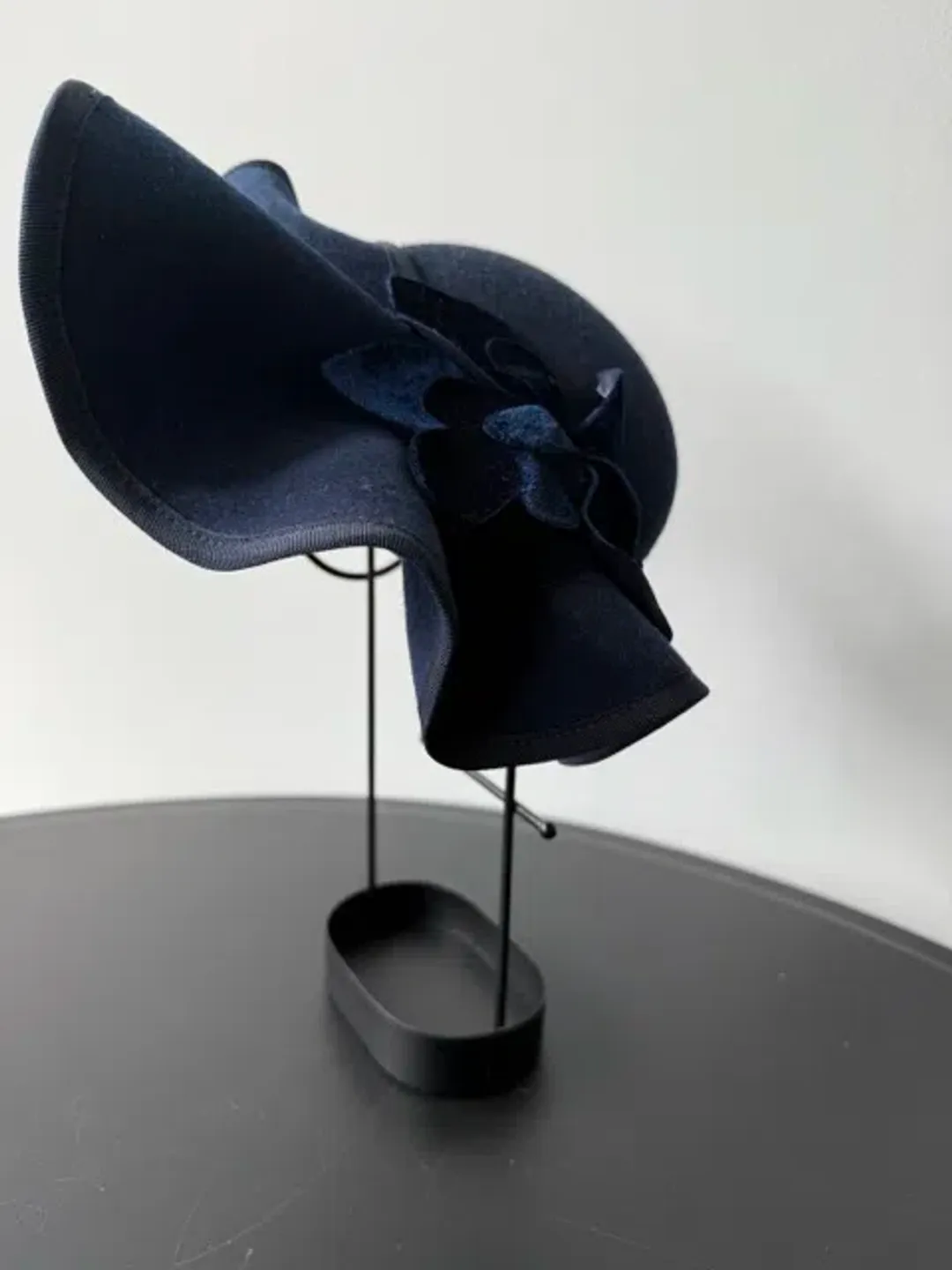 Felted Wool Headpiece with Sculptural Detail and Floral Velvet Adornment Navy One Size for rent on The Volte - main image