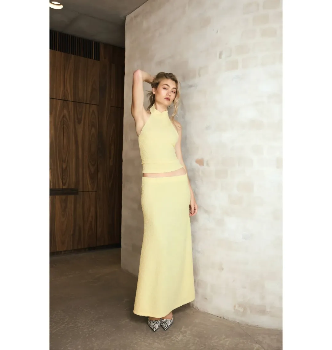 With Harper Lu Textured Halter Top and Maxi Skirt in Limoncello Set Size M / AU 10 for rent on The Volte - main image