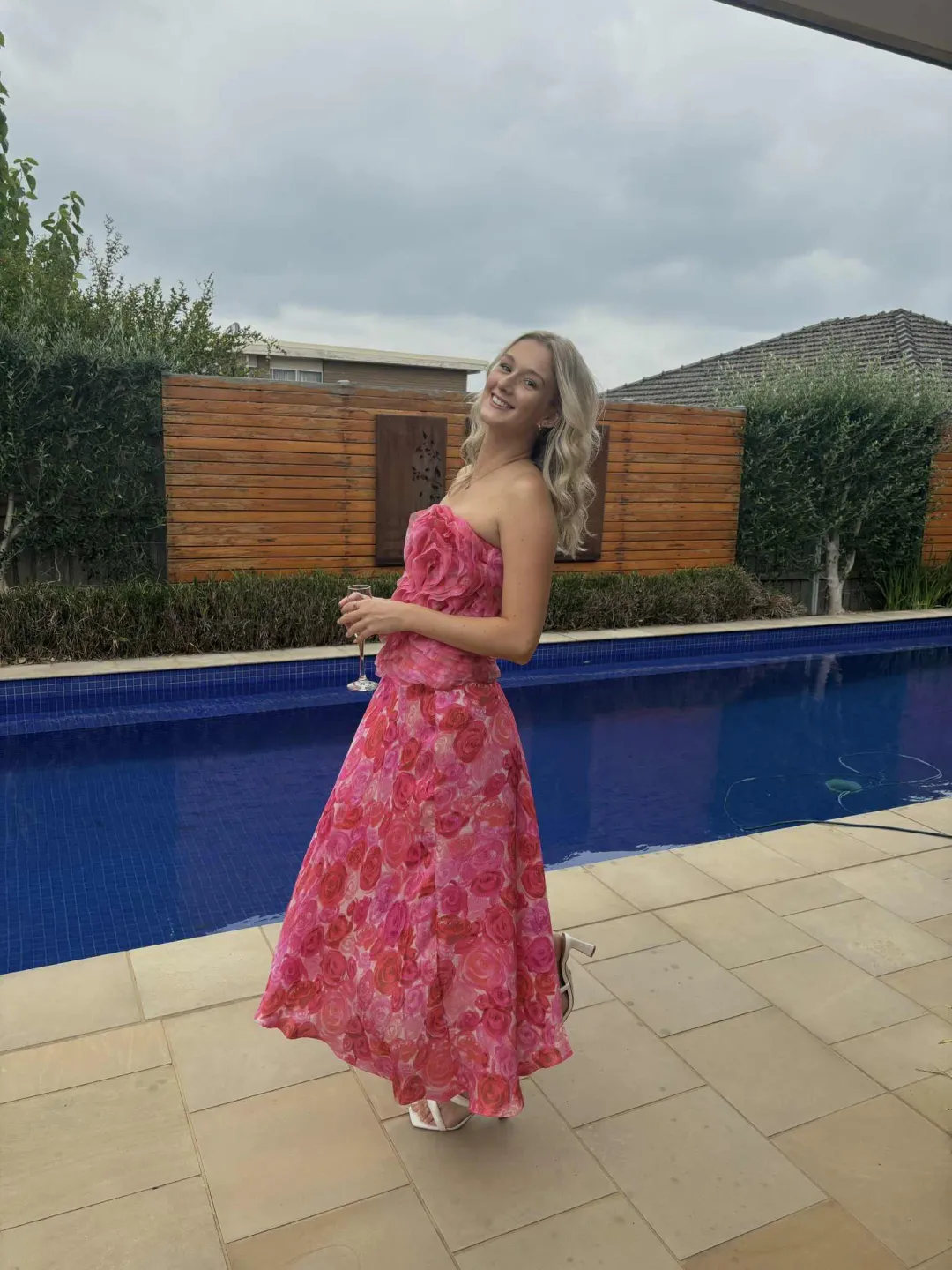 Aje Charmed Rosette Ruffle Bustier with Valeria Asymmetrical Midi Skirt in Misty Rose Size 6 for rent on The Volte - main image