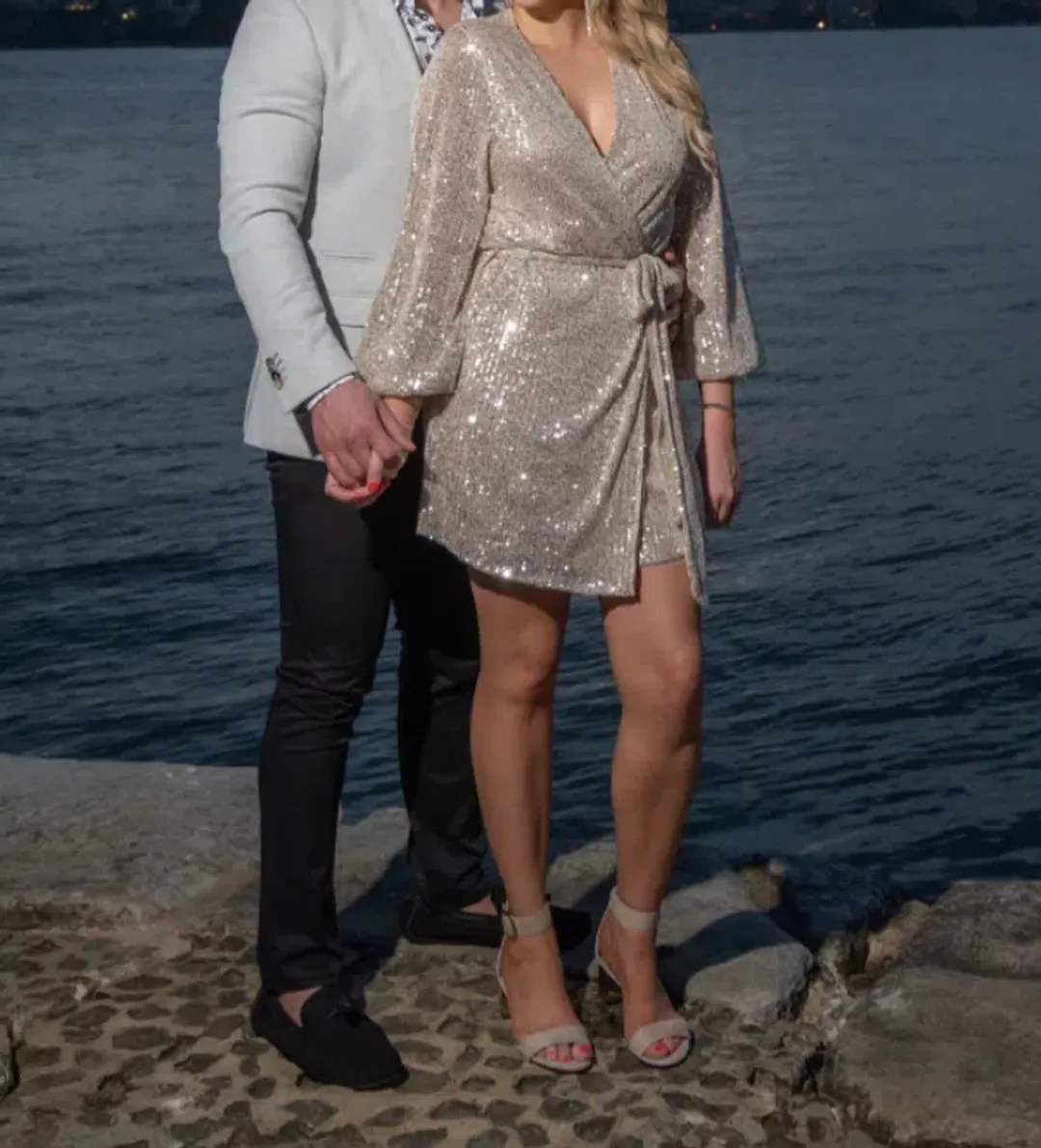 Club London In Awe Silver Sequin Wrap Long Sleeve Belted Mini Dress Size 8 for rent on The Volte - main image