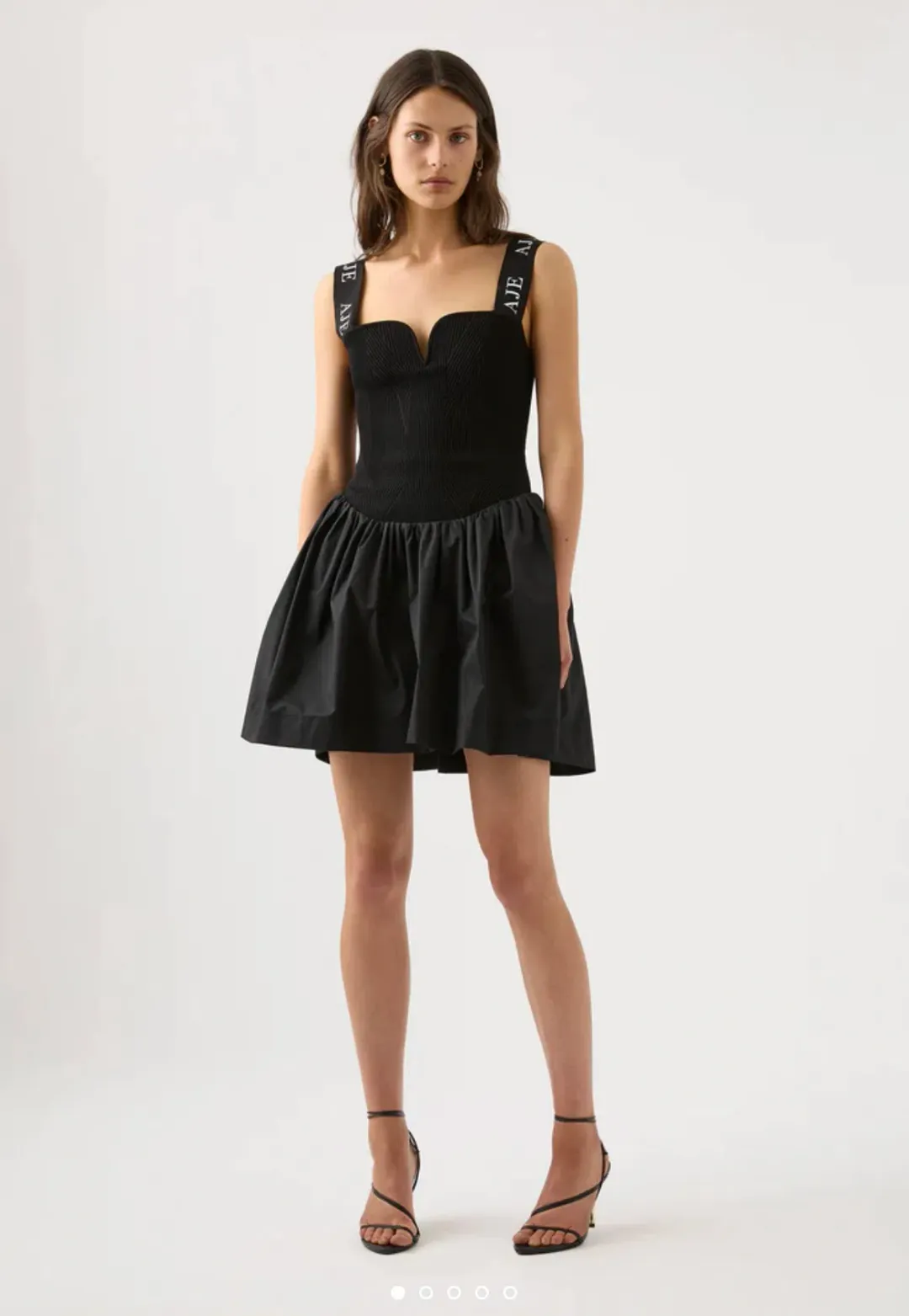 Aje Mira Logo Strap Tulip Mini Dress Black Size XL / Au 14 for rent on The Volte - main image