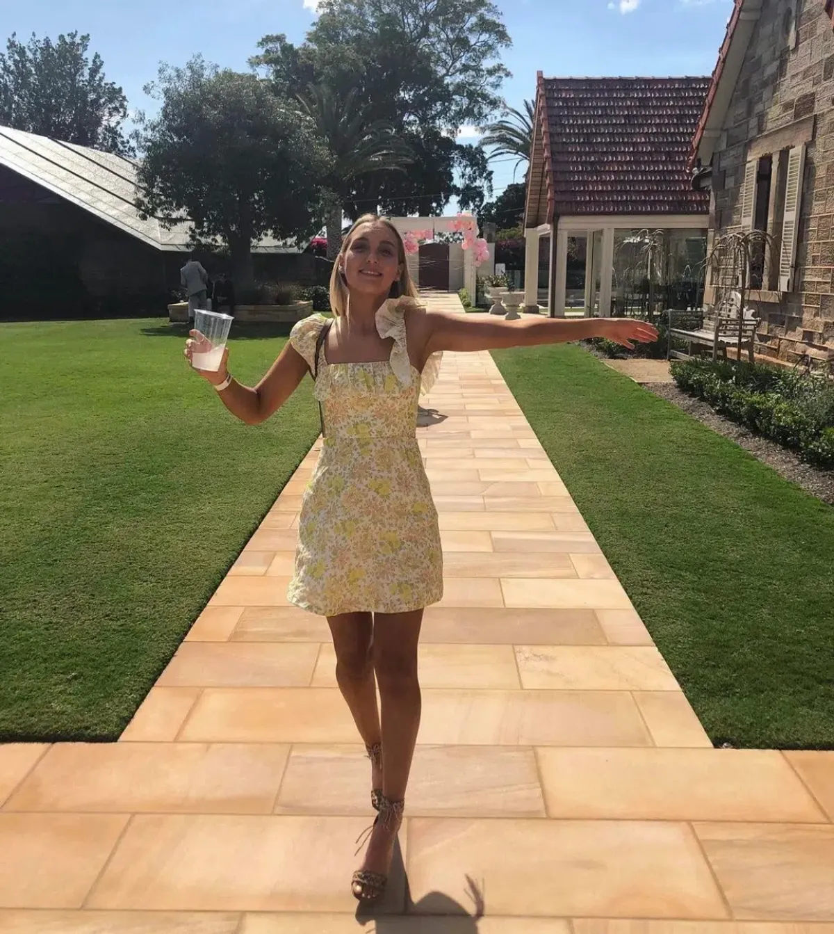 Zimmermann Goldie Ruffle Neck Mini Dress in Citrus Floral Size 0 / Au 8 for rent on The Volte - main image