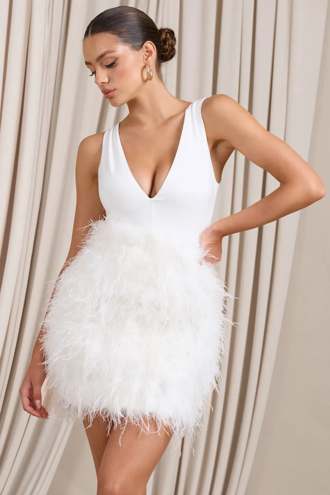 Club L London Flirt  Plunge Front Mini Dress with Feather Skirt White Size 4  for rent on The Volte - main image