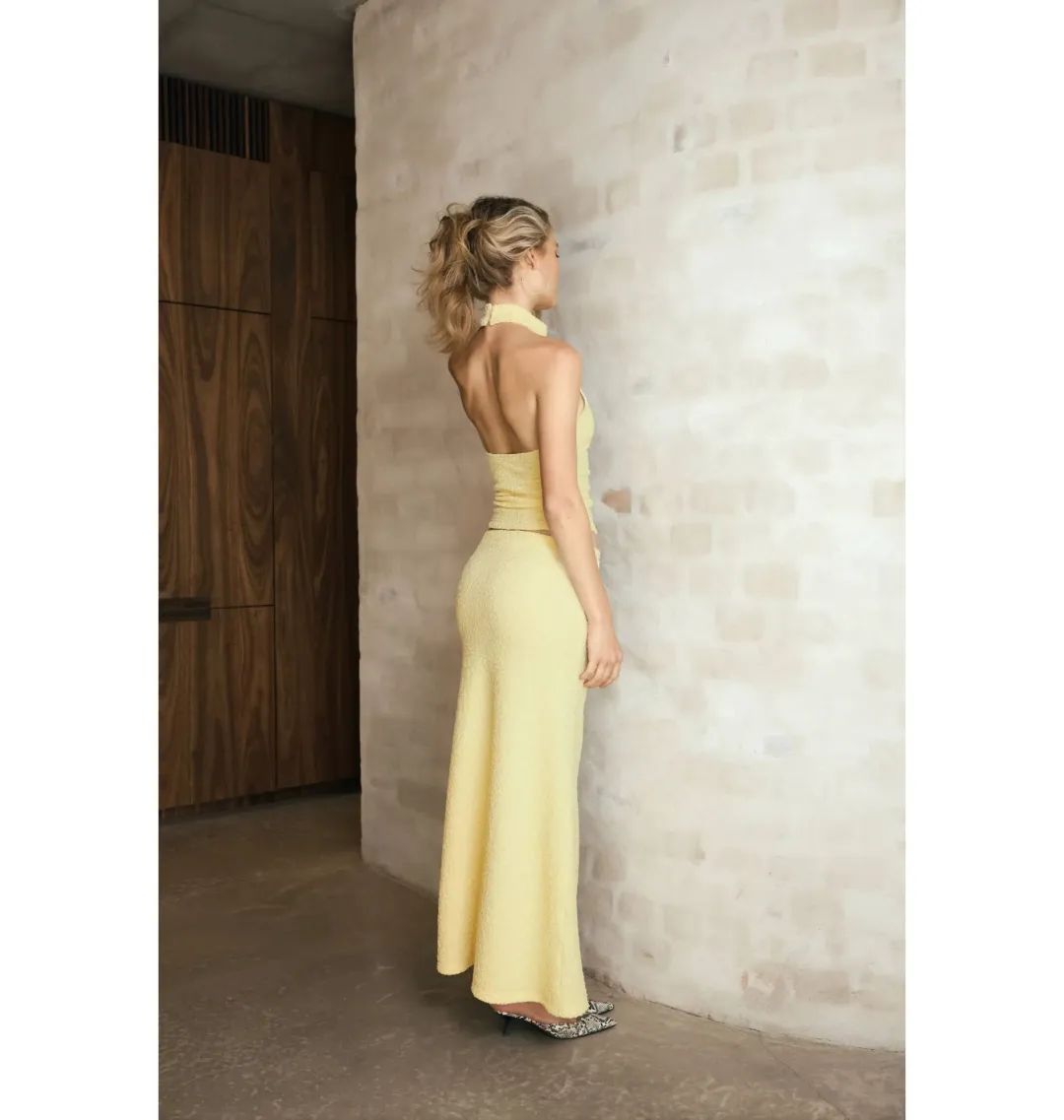With Harper Lu Textured Halter Top and Maxi Skirt in Limoncello Set Size XS / AU 6 for rent on The Volte - main image