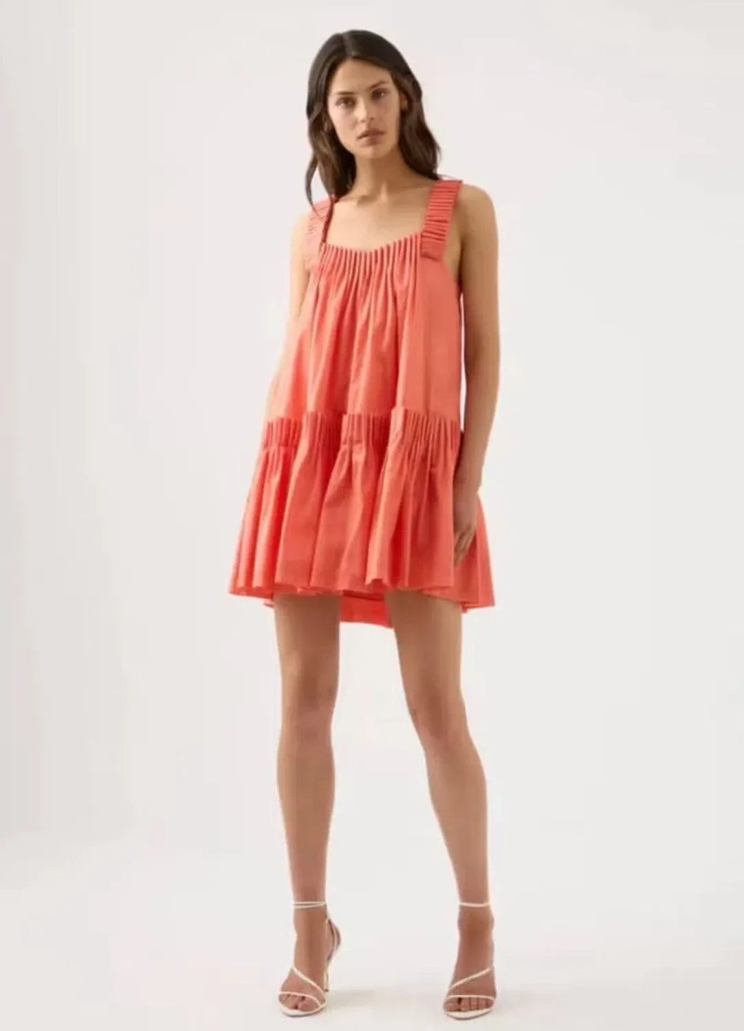 AJE CECILIA SMOCK MINI DRESS IN CORAL PEACH SIZE AU 6 for rent on The Volte - main image