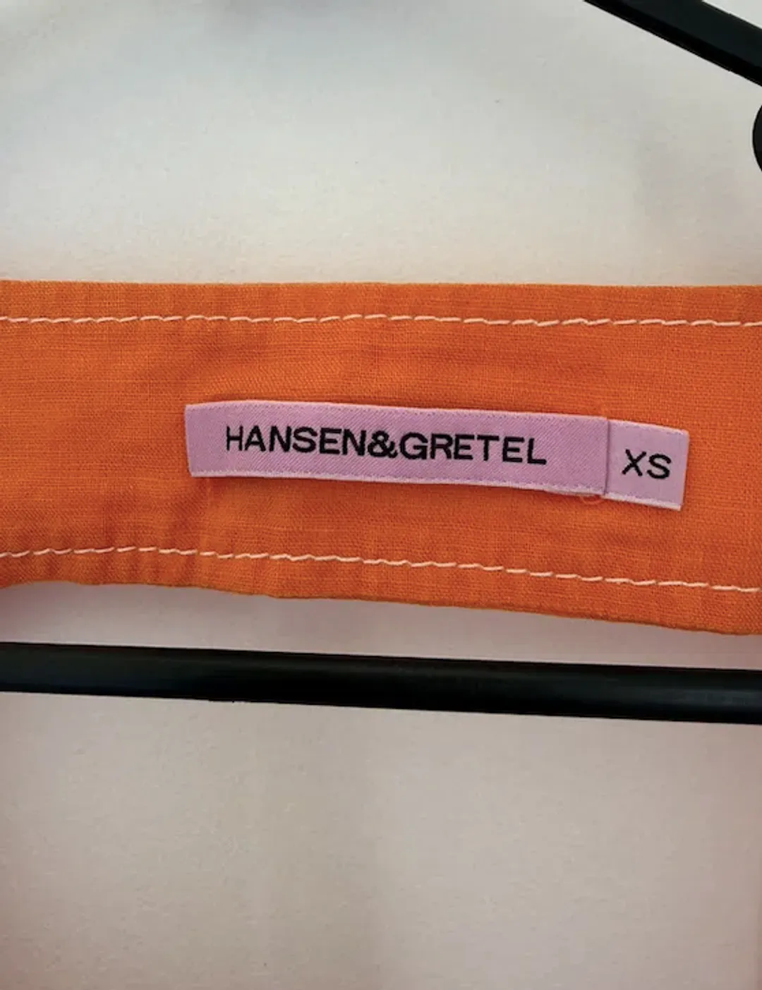 Hansen & Gretel Paloma Dress In Tangerine for rent on The Volte - main image