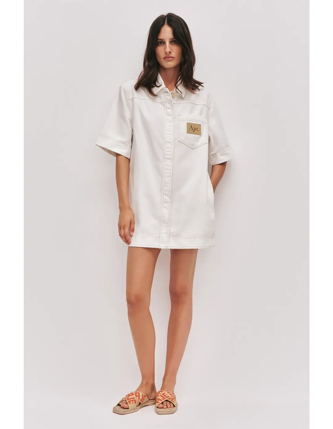 Aje Studio Lumi Denim Mini Tunic Dress Cream Size 12 for rent on The Volte - main image