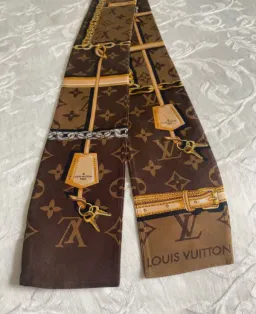 Louis Vuitton Silk Monogram Confidential Bandeau Scarf Brown for rent on The Volte - image 2