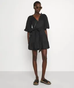 Faithfull the Brand Rooney Wrap Mini Dress Black Size 8 for rent on The Volte - image 1